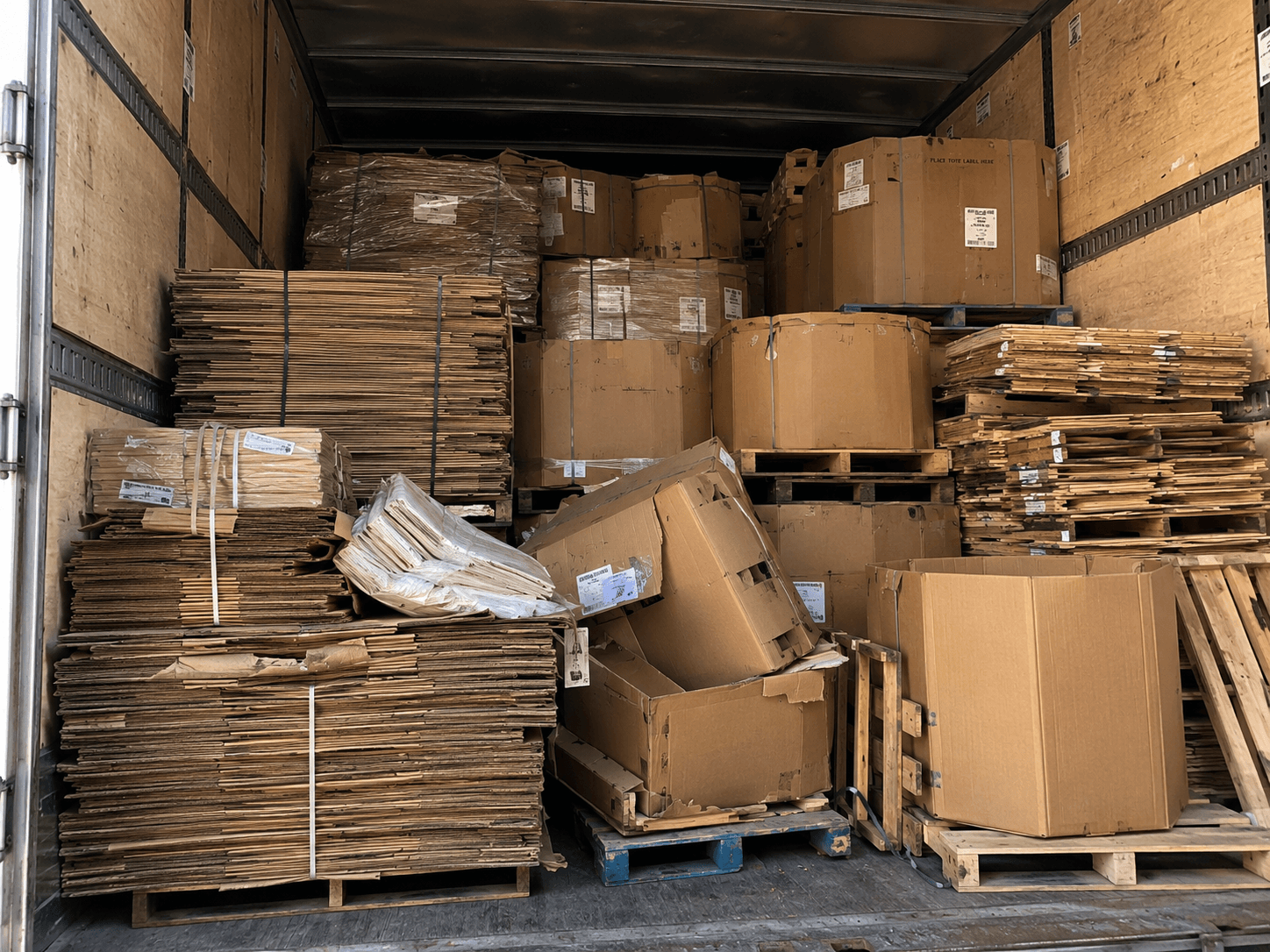A trailer of mixed used boxes returned for grading, reuse and upcycling